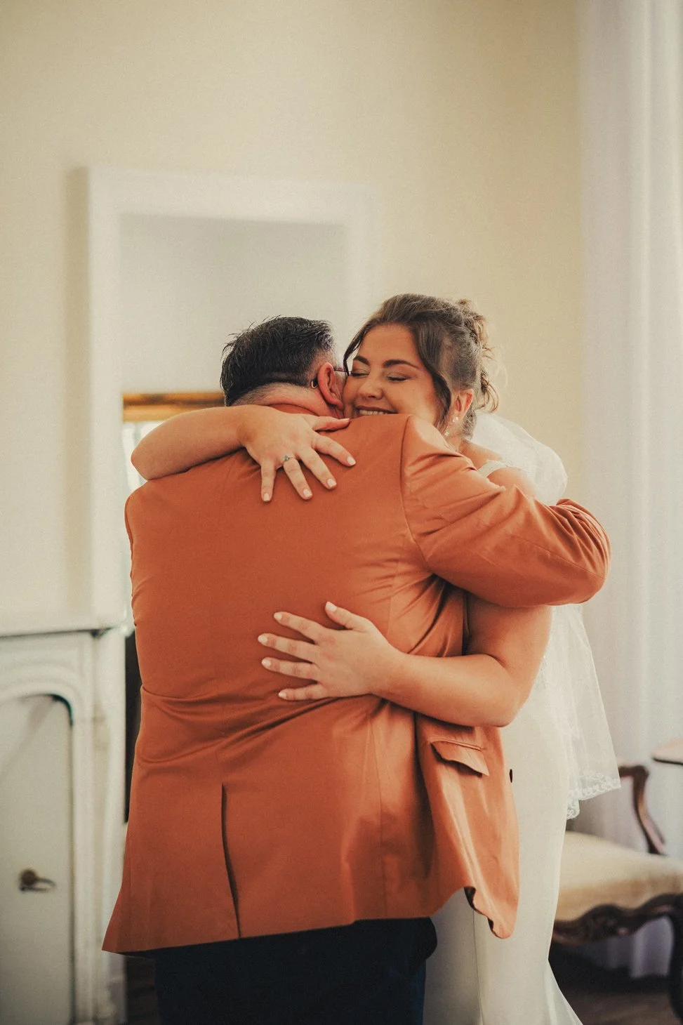 Emotional first look between bride and father before ceremony