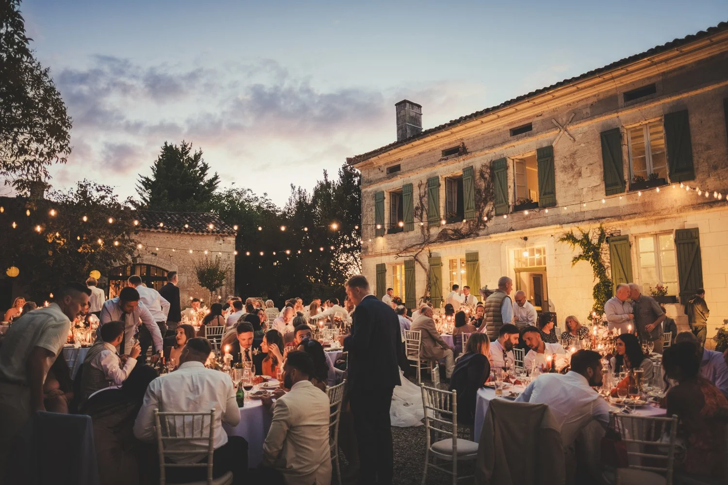 wedding dinner blue hour garlands lights manoir de longeveau