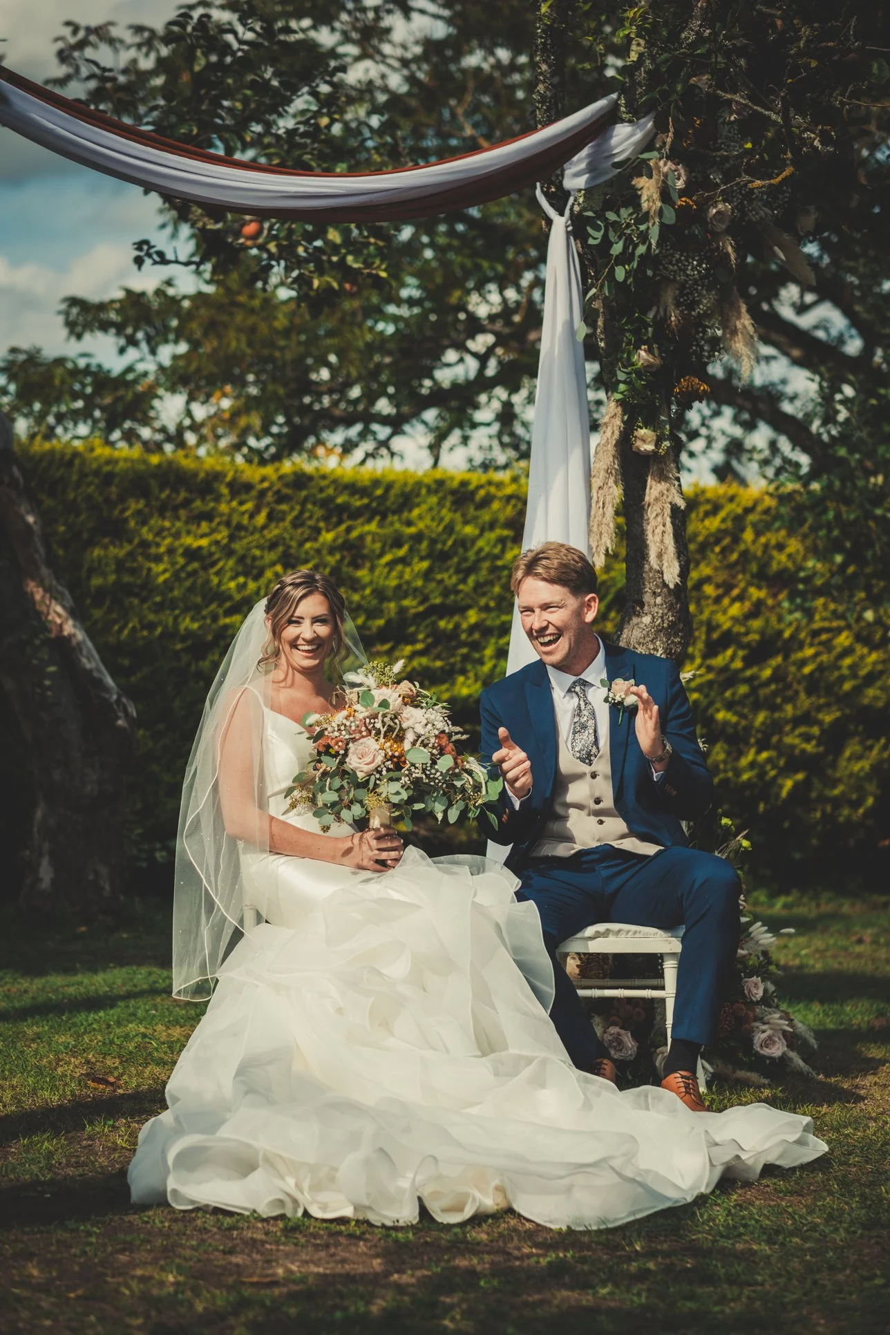 bride groom smiling listening speech ceremony
