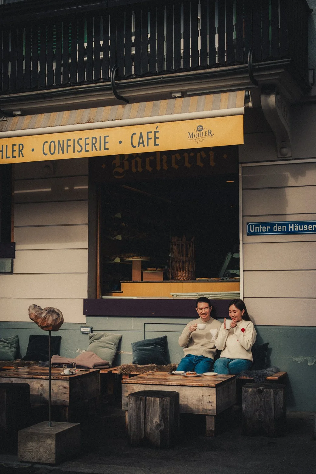 Couple sharing pastries and coffee during a relaxed honeymoon morning in Interlaken.