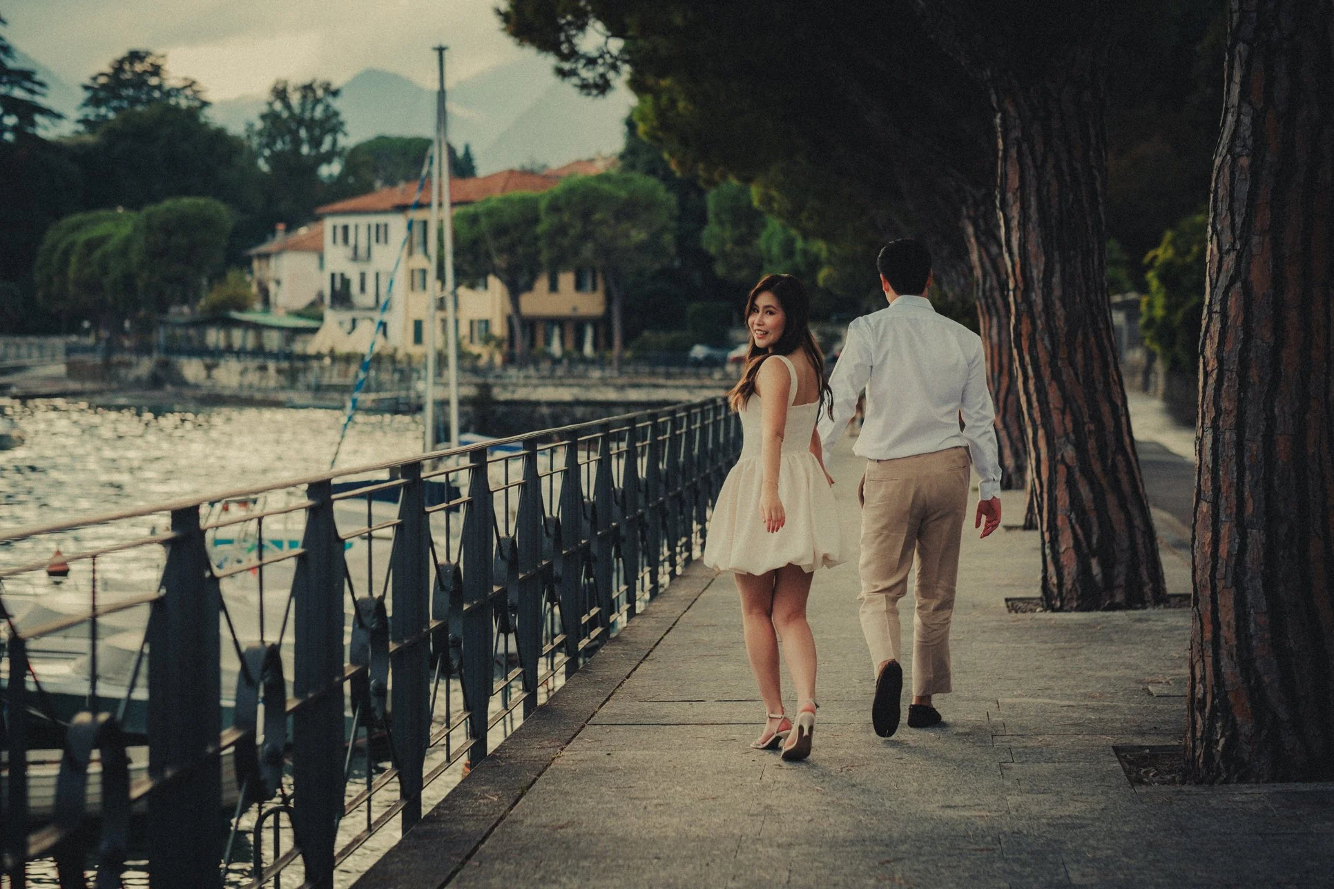 Couple strolling in Lenno for their engagement session.