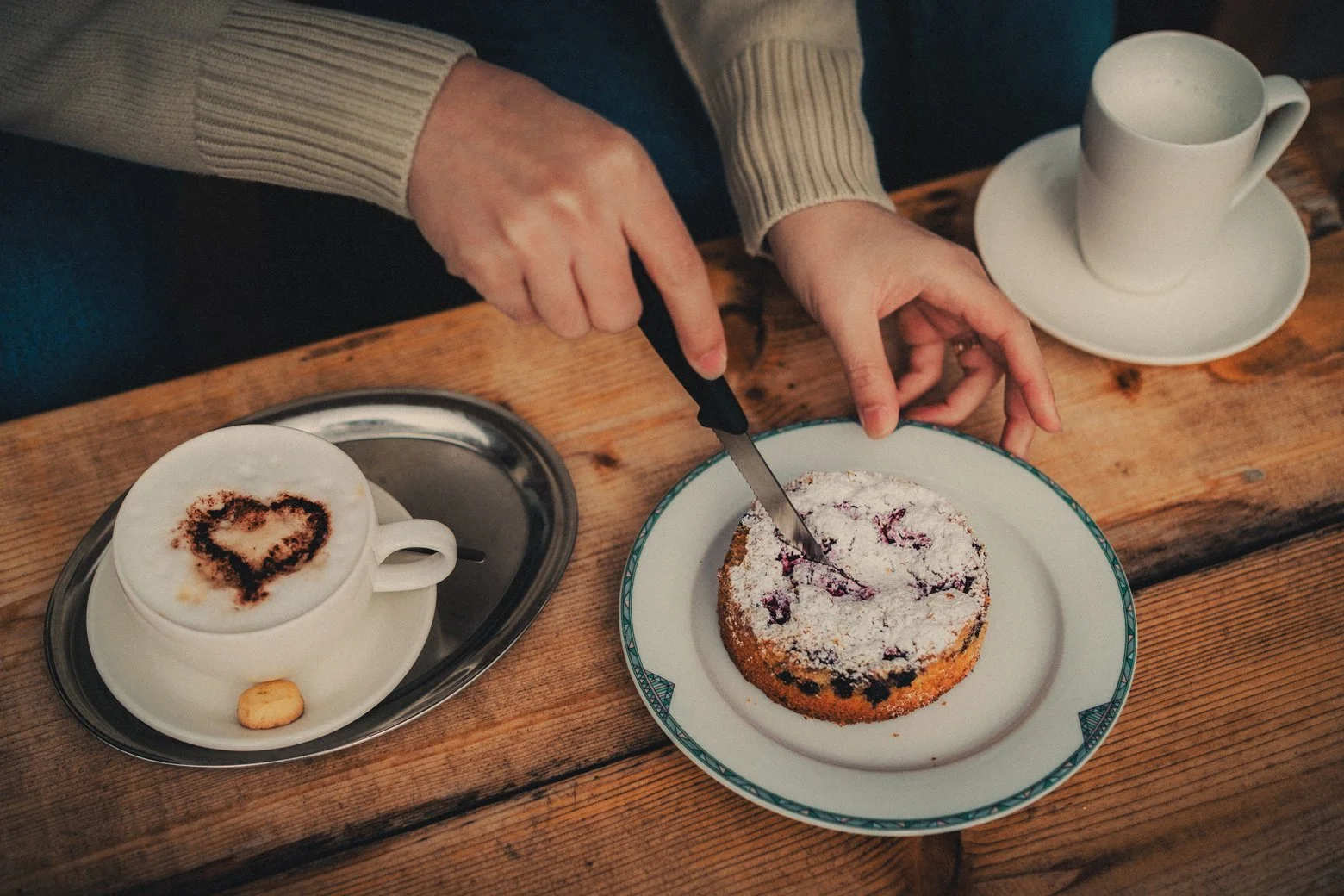 Natural honeymoon photography of a couple sharing breakfast in Interlaken.