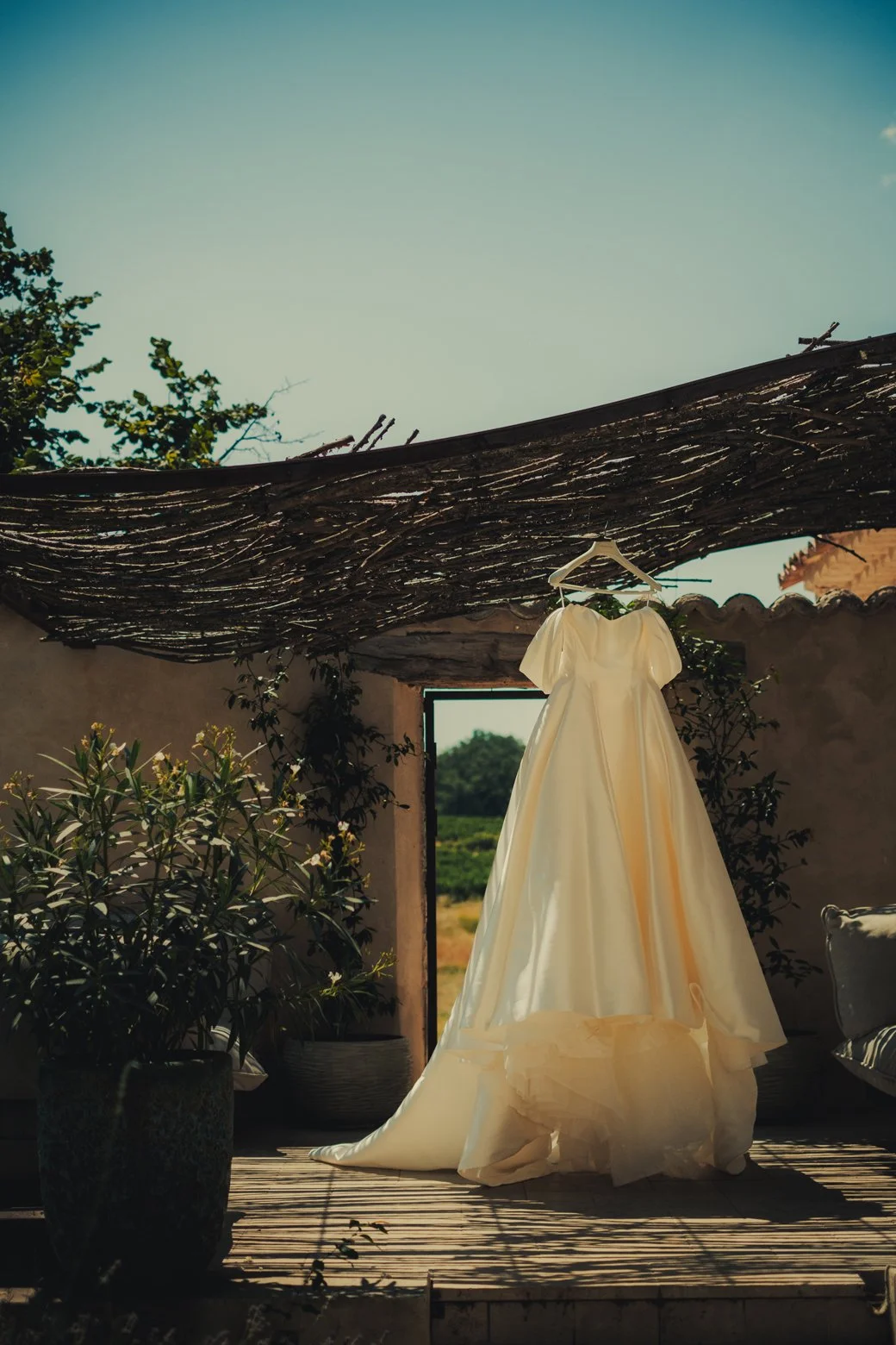 Provence wedding photographer capturing a stunning wedding gown outdoor at Domaine les Mûriers.