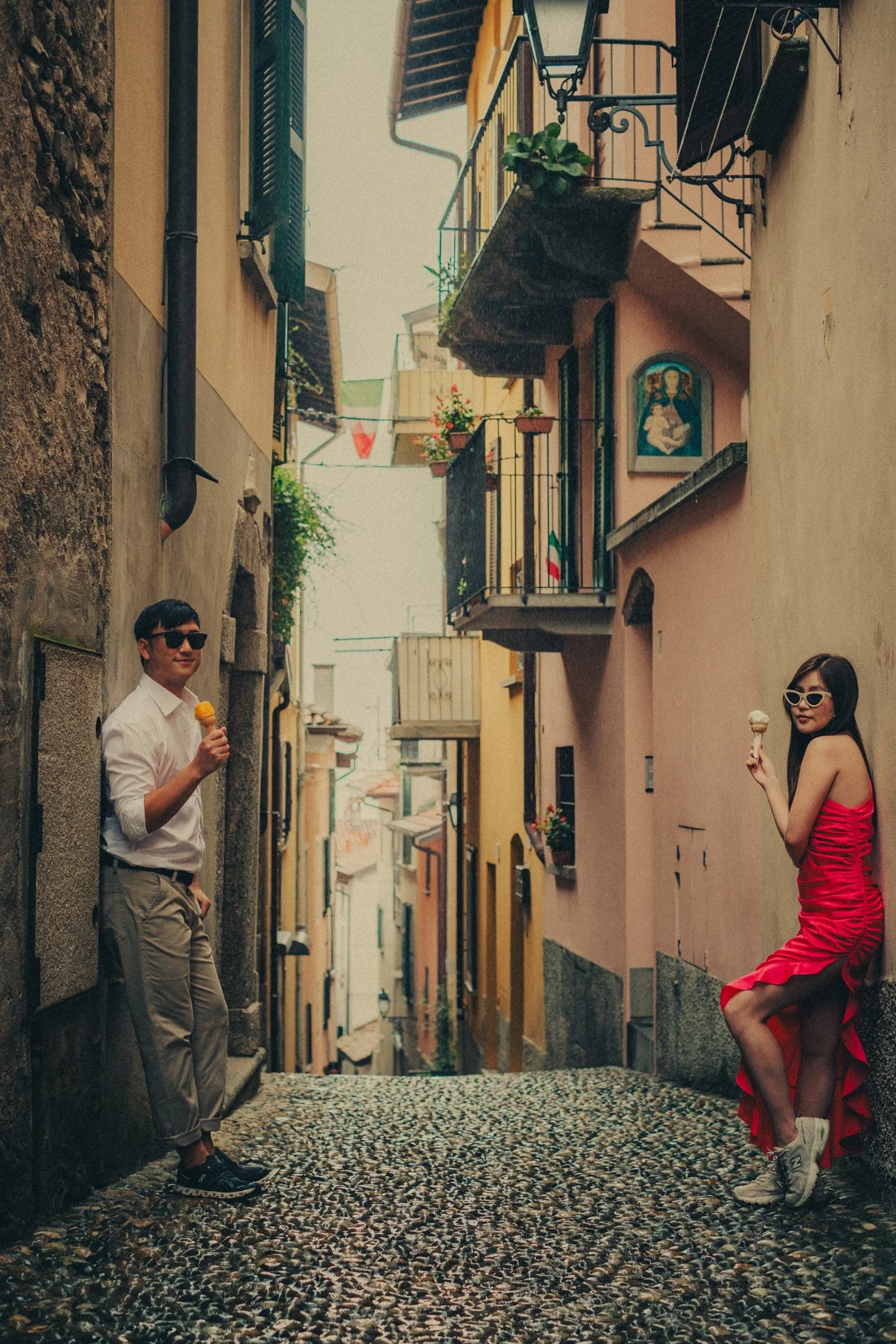 Lake Como pre-wedding photographer capturing a couple in the street of Bellagio.