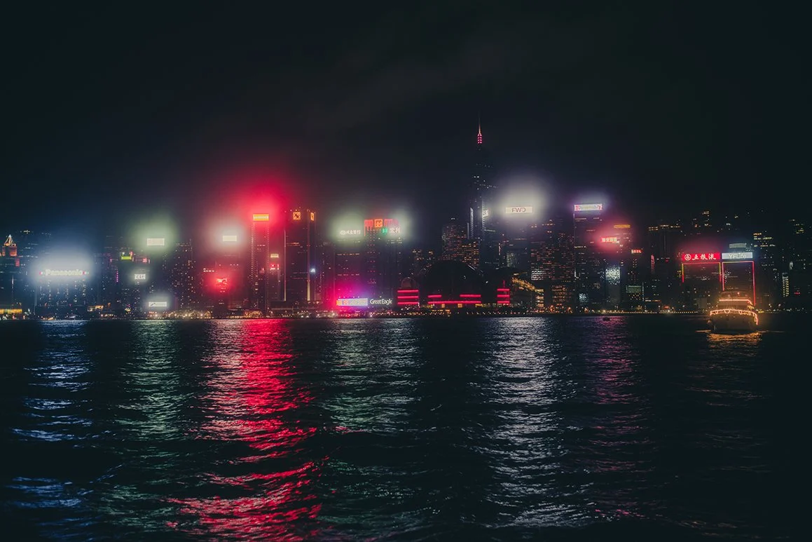 An elopement photographer capturing Hong Kong at night at Victoria Harbour.