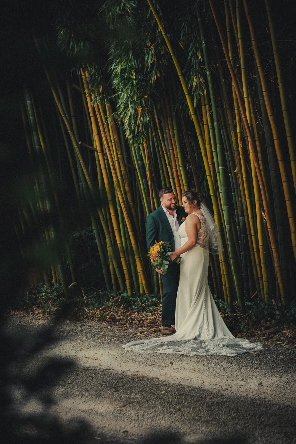 couple candid moment at the bamboo garden fo chateau la gauterie