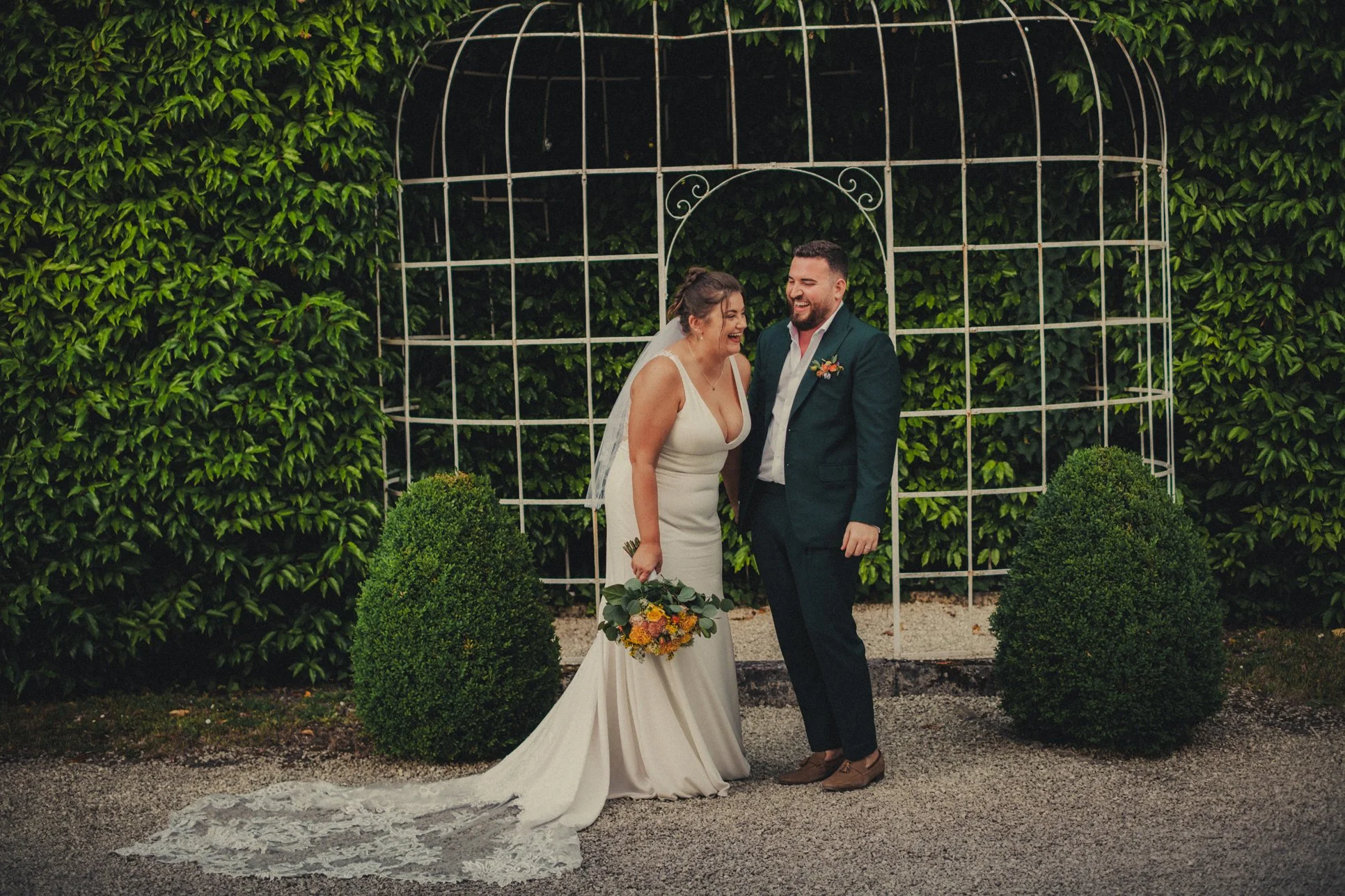 couple laughing during wedding portrait session
