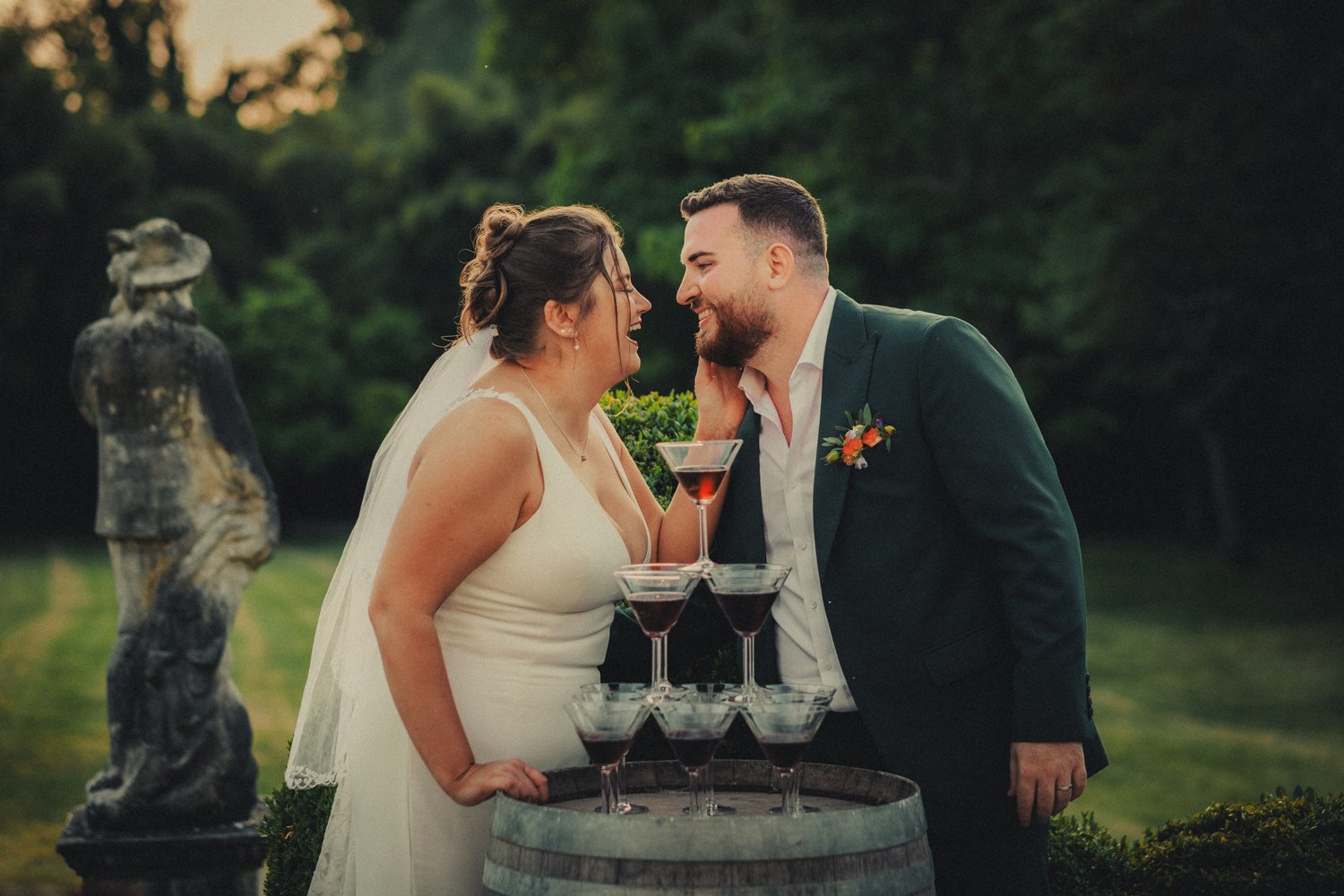 Bride and groom celebrating with espresso martini tower