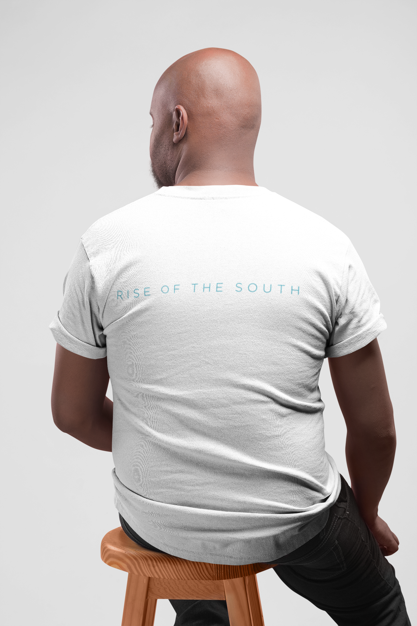 tshirt-mockup-featuring-the-back-of-a-man-sitting-on-a-stool-20784.png