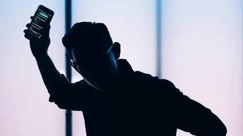 man+dancing+phone+unsplash.jpg