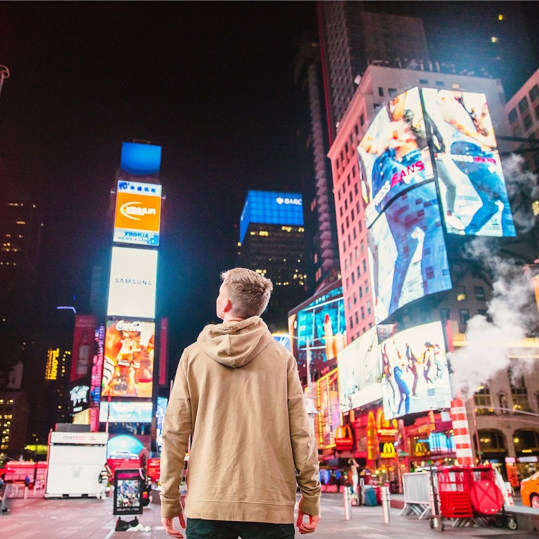 A man looking up in New York Times Square