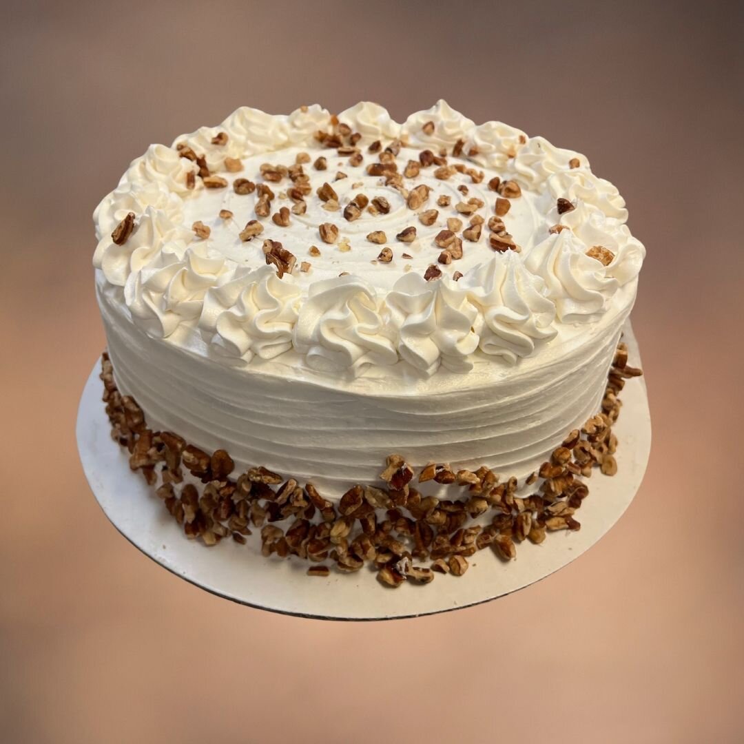 Indulge in the heavenly taste of our Italian Cream Cake! 

At Carolyn&rsquo;s Bake Shop, we take pride in crafting this moist and fluffy cake, adorned with a rich cream cheese frosting and sprinkled generously with roasted pecans. Every bite promises