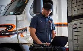 truck technician with laptop.jpeg