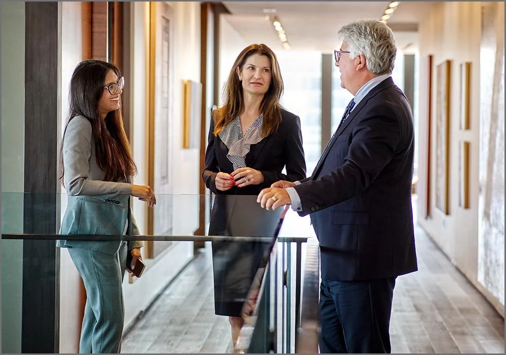 CORPORATE LIFESTYLE LAWYERS TALKING IN HALLWAY.jpg