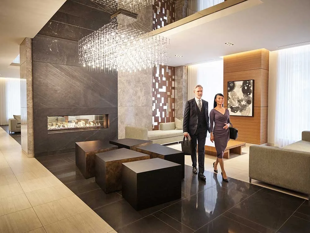 Couple walking through building lobby