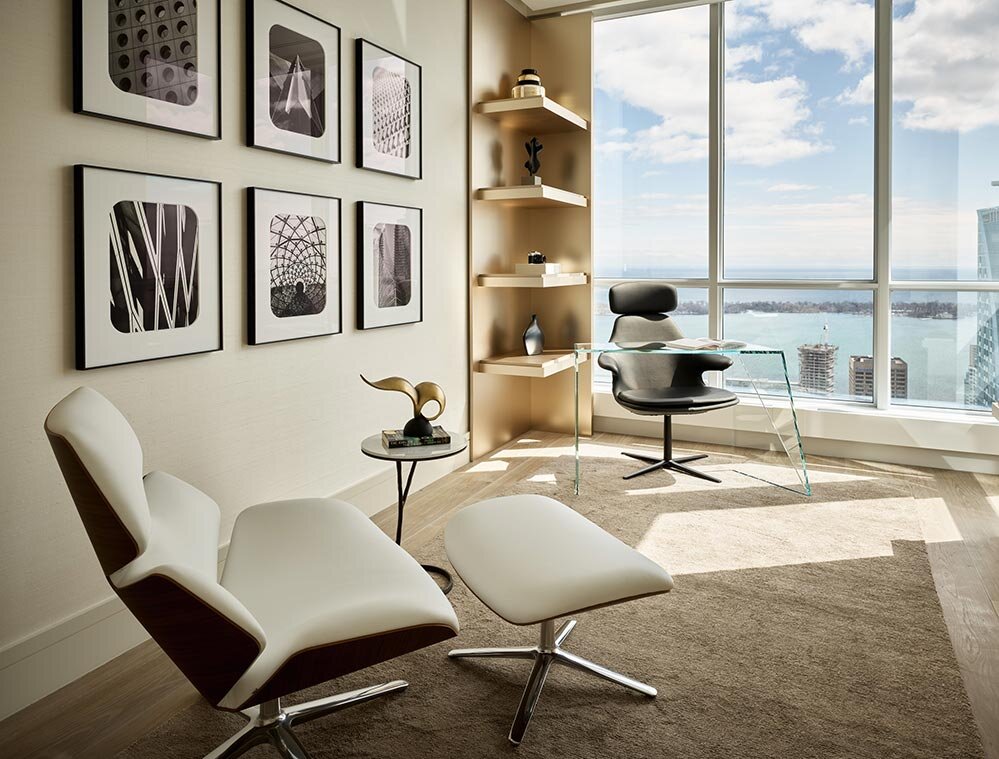 Architectural photo of lounge chairs in family room of condo