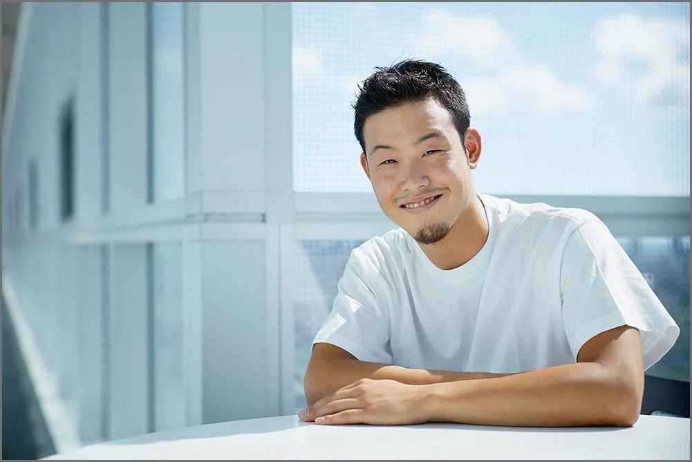 post secondary education portrait of student seated at desk.jpg