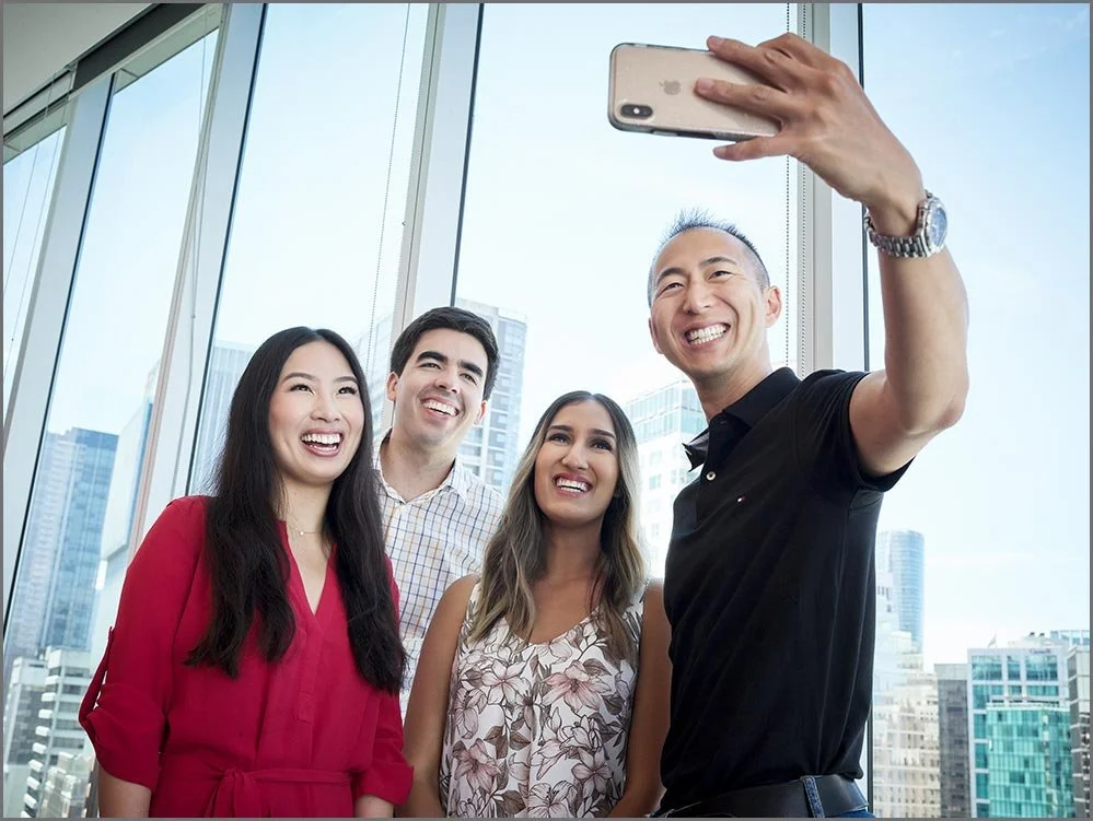 corporate lifestyle coworkers taking group selfie.jpg