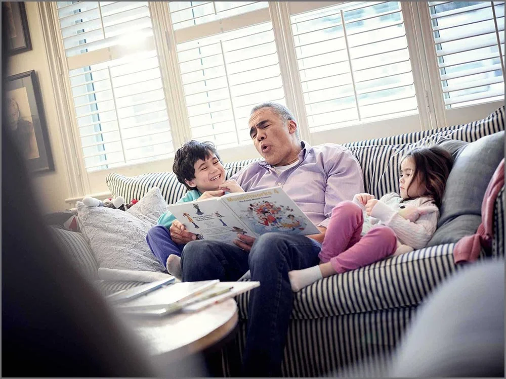  lifestyle advertising grandparent grandchildren on couch.jpg