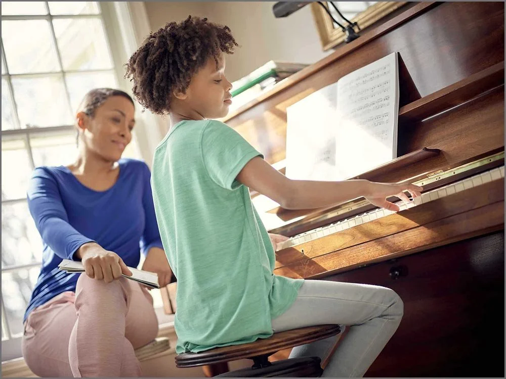 family lifesyle child playing piano.jpg