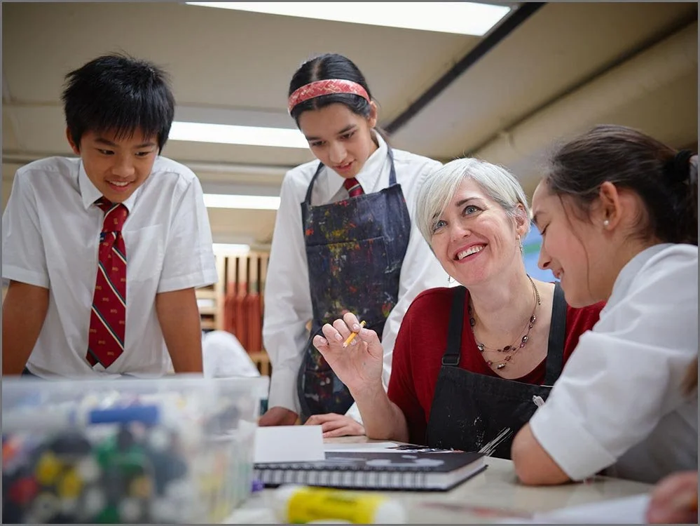 private school art teacher with students.jpg