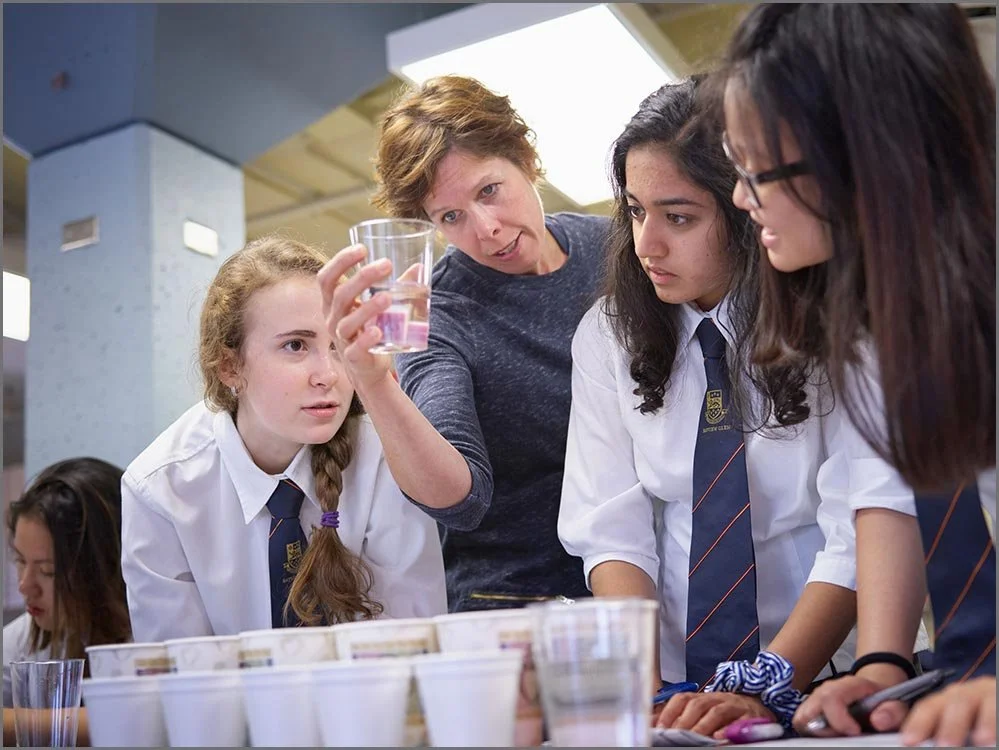 private school professor with students.jpg