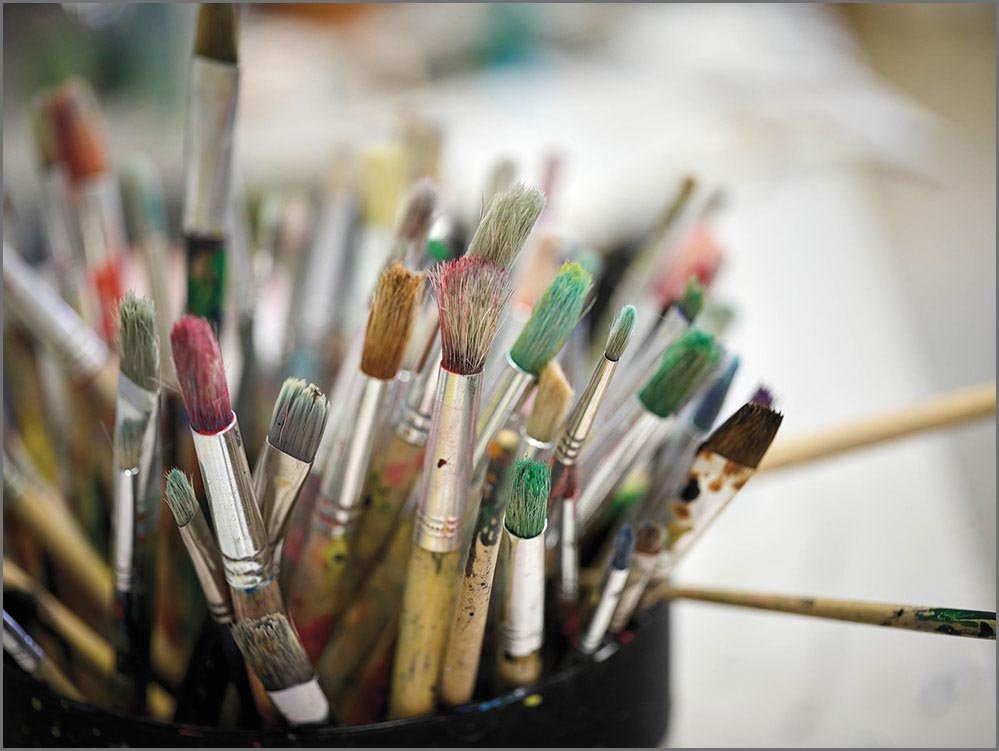 private school paintbrushes in can.jpg