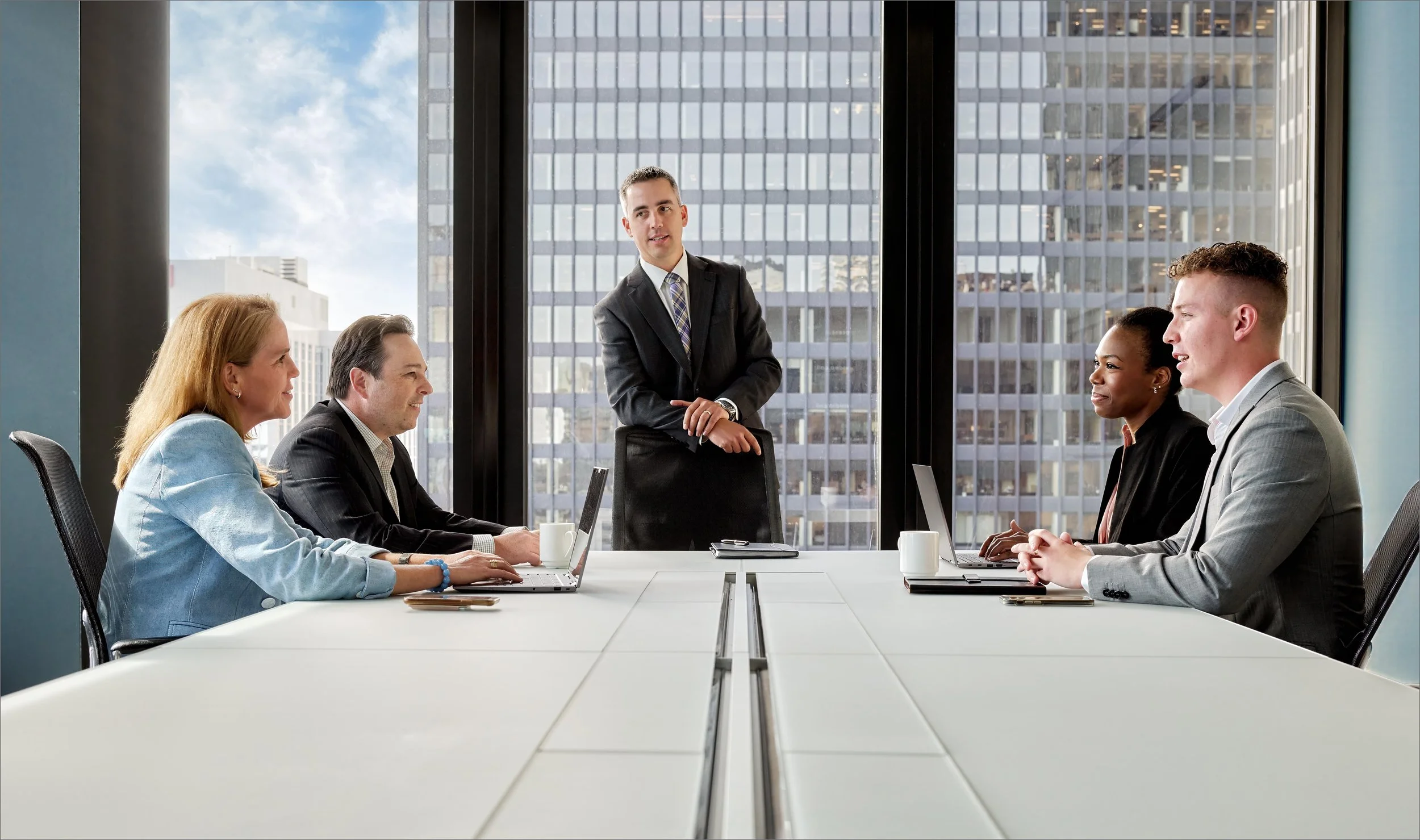 Corporate lifestyle executives in meeting room.jpg