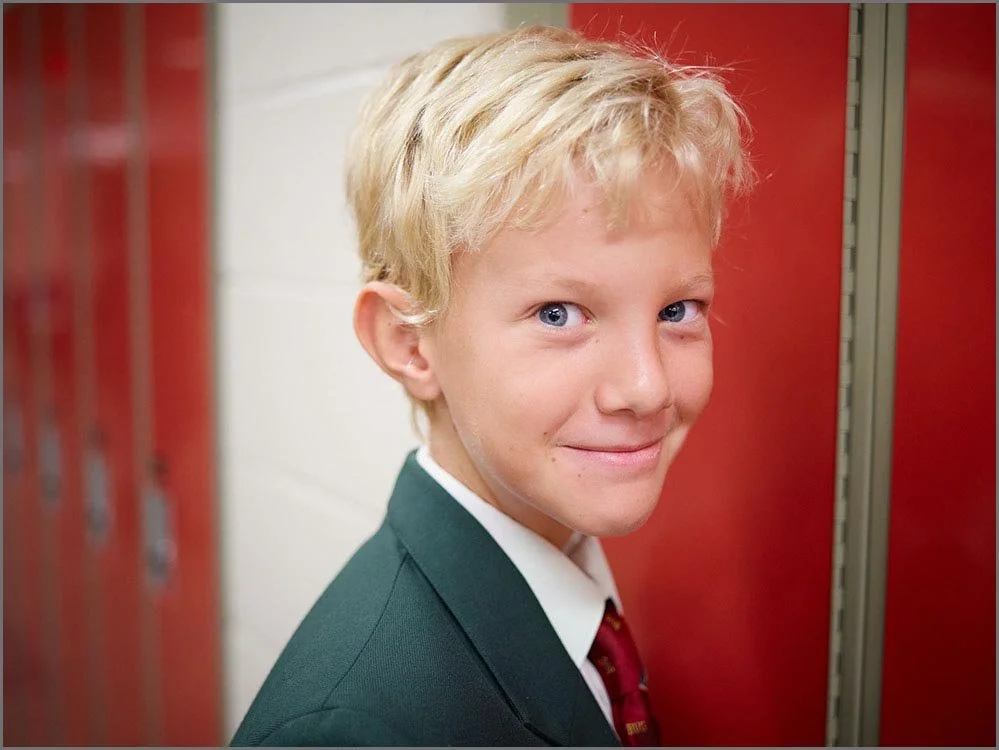 private school portrait of child near lockers.jpg