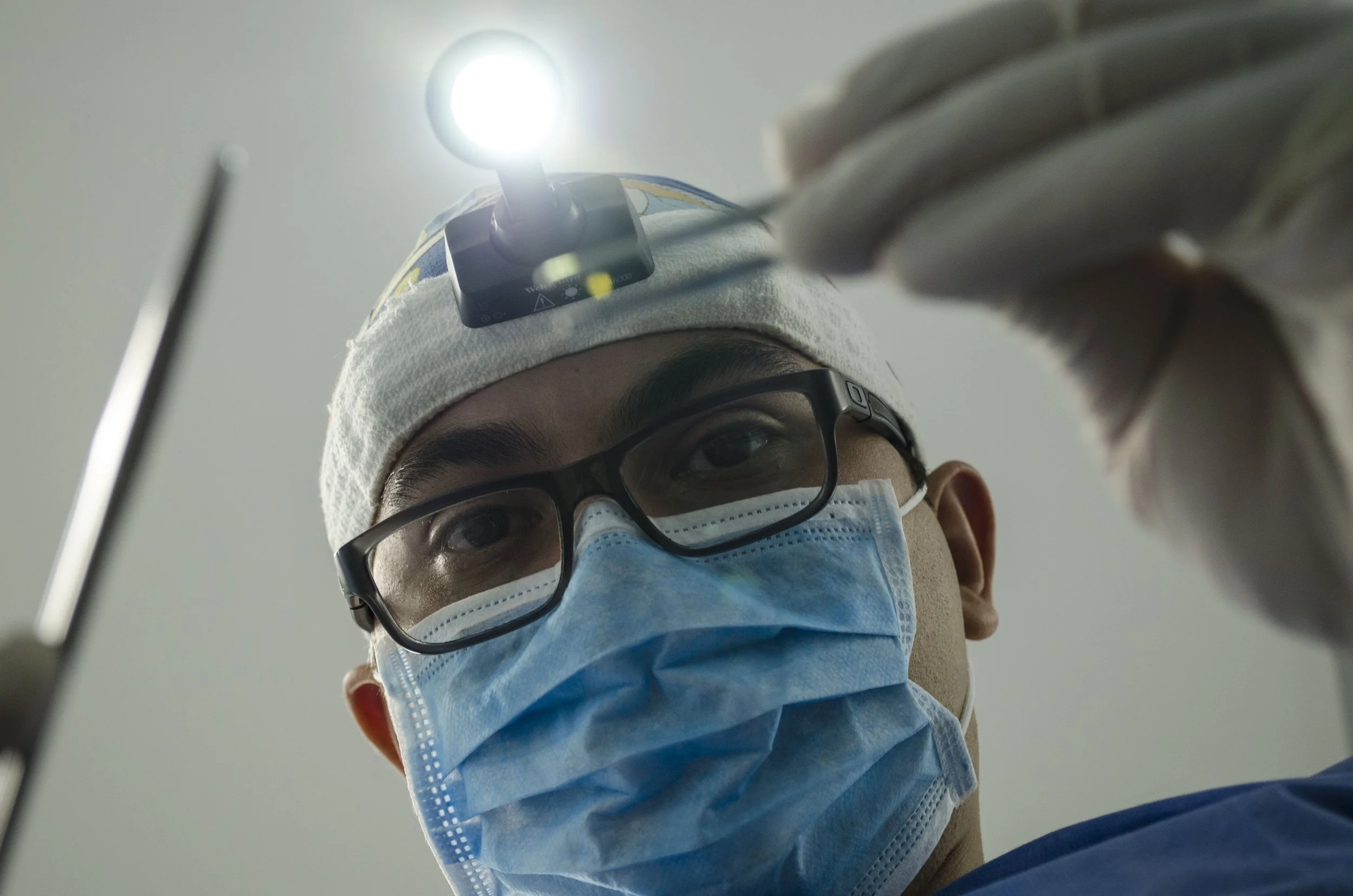 Dentist examining oral health problems in patient.