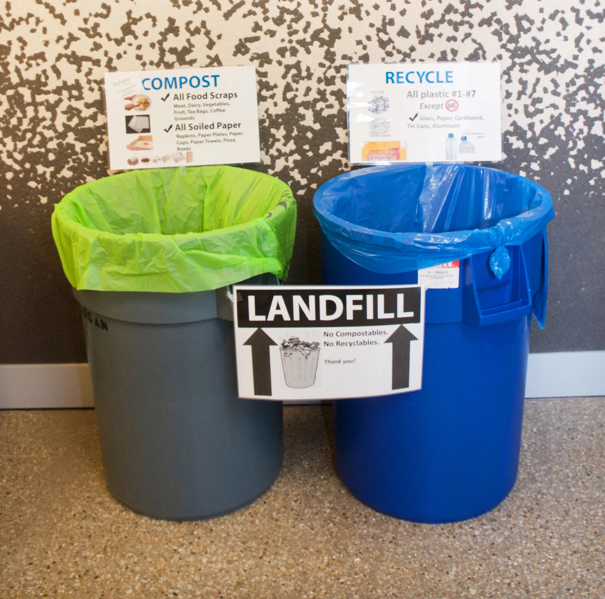 Two garbage cans.