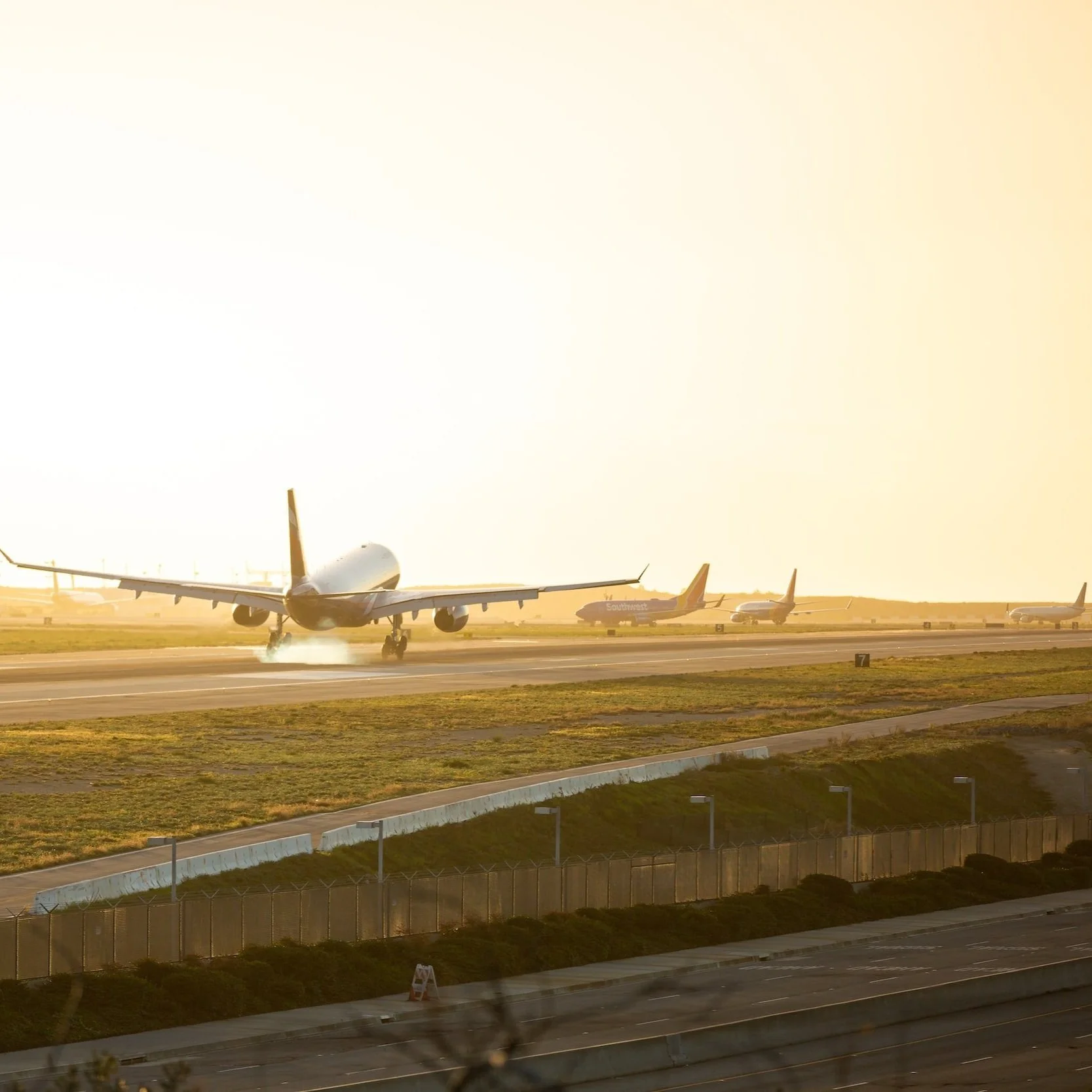 Airplane landing at a Los Angeles airport for relocation services and out-of-town buyers.