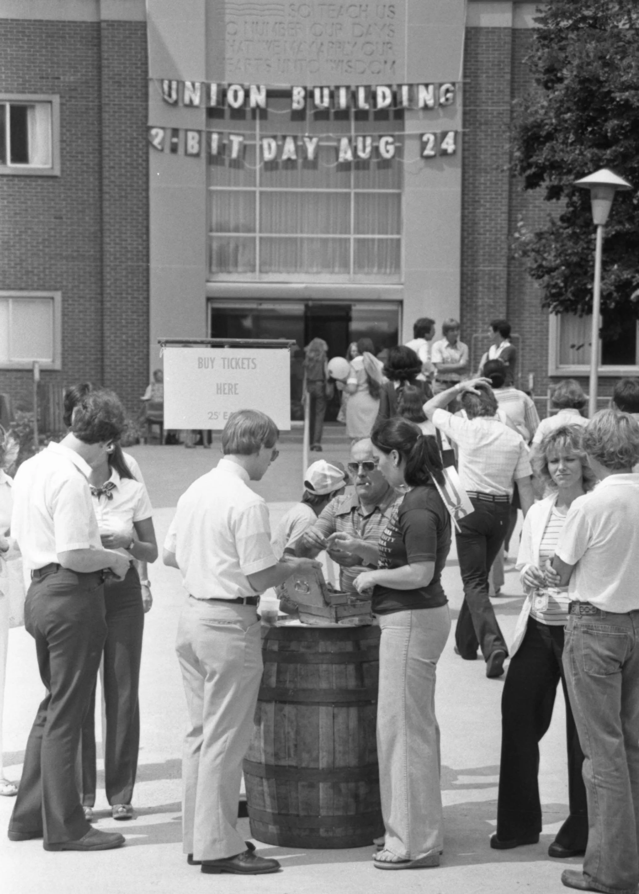 A beginning-of-the-year fair at IUPUI, circa 1978, with a biblical reminder of mortality—Psalm 90:12—faintly visible in the inscription above the entrance of the Union Building. (Indiana University photograph by Ed Lacey, Jr., courtesy of University…