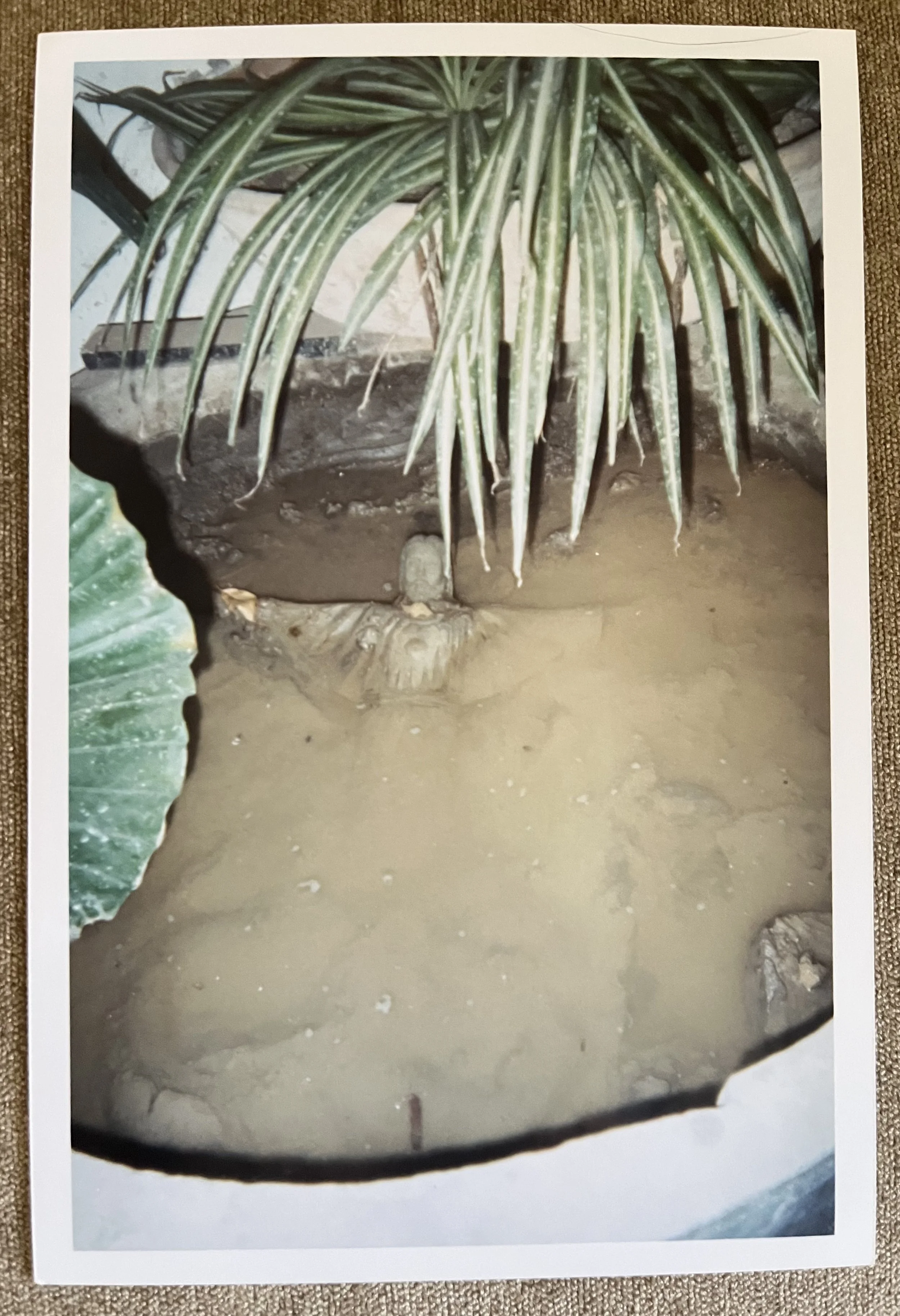 unfired clay sculpture of risen christ in slaking bucket