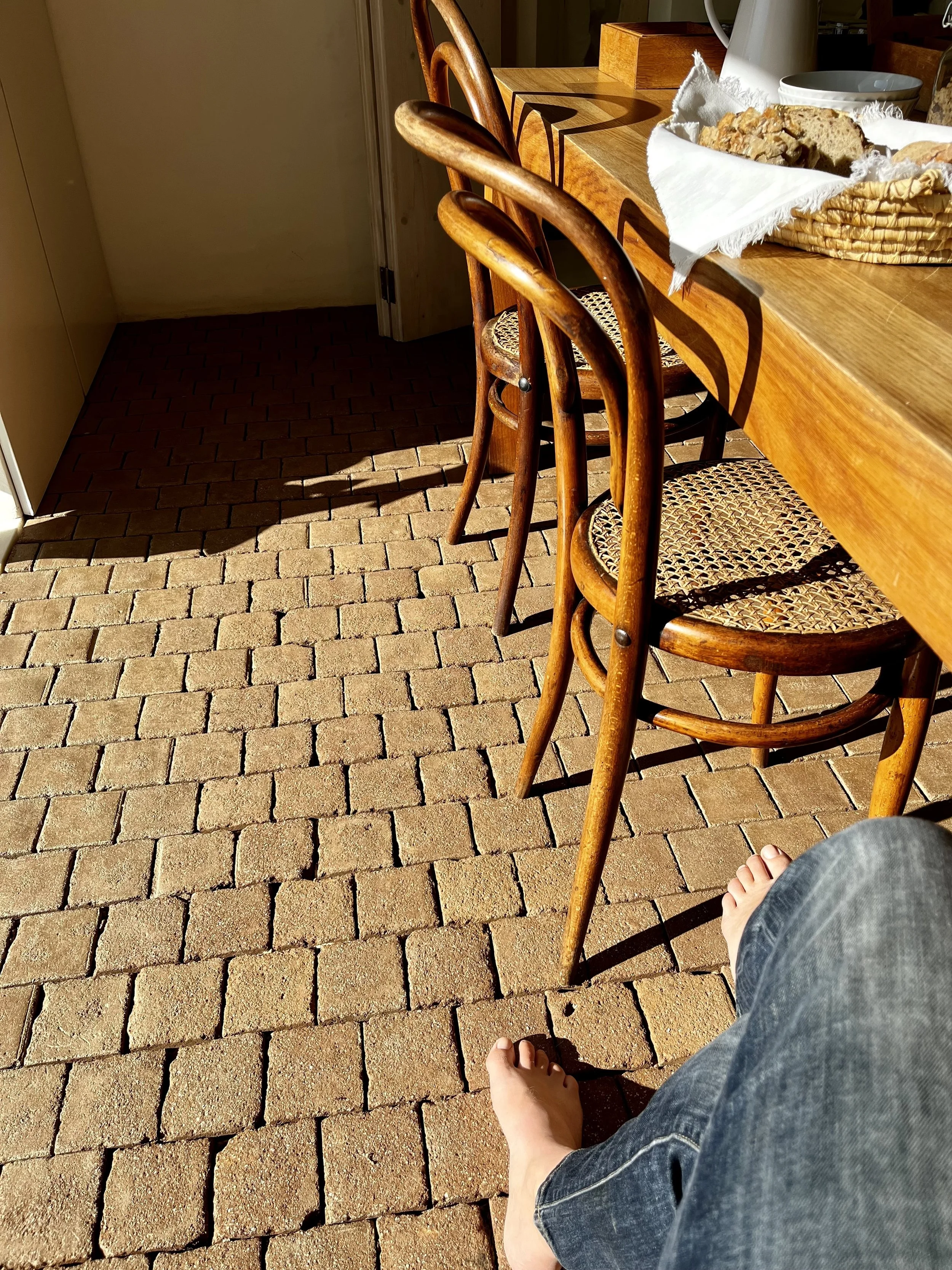 Sitting at the kitchen table in the sunbeam