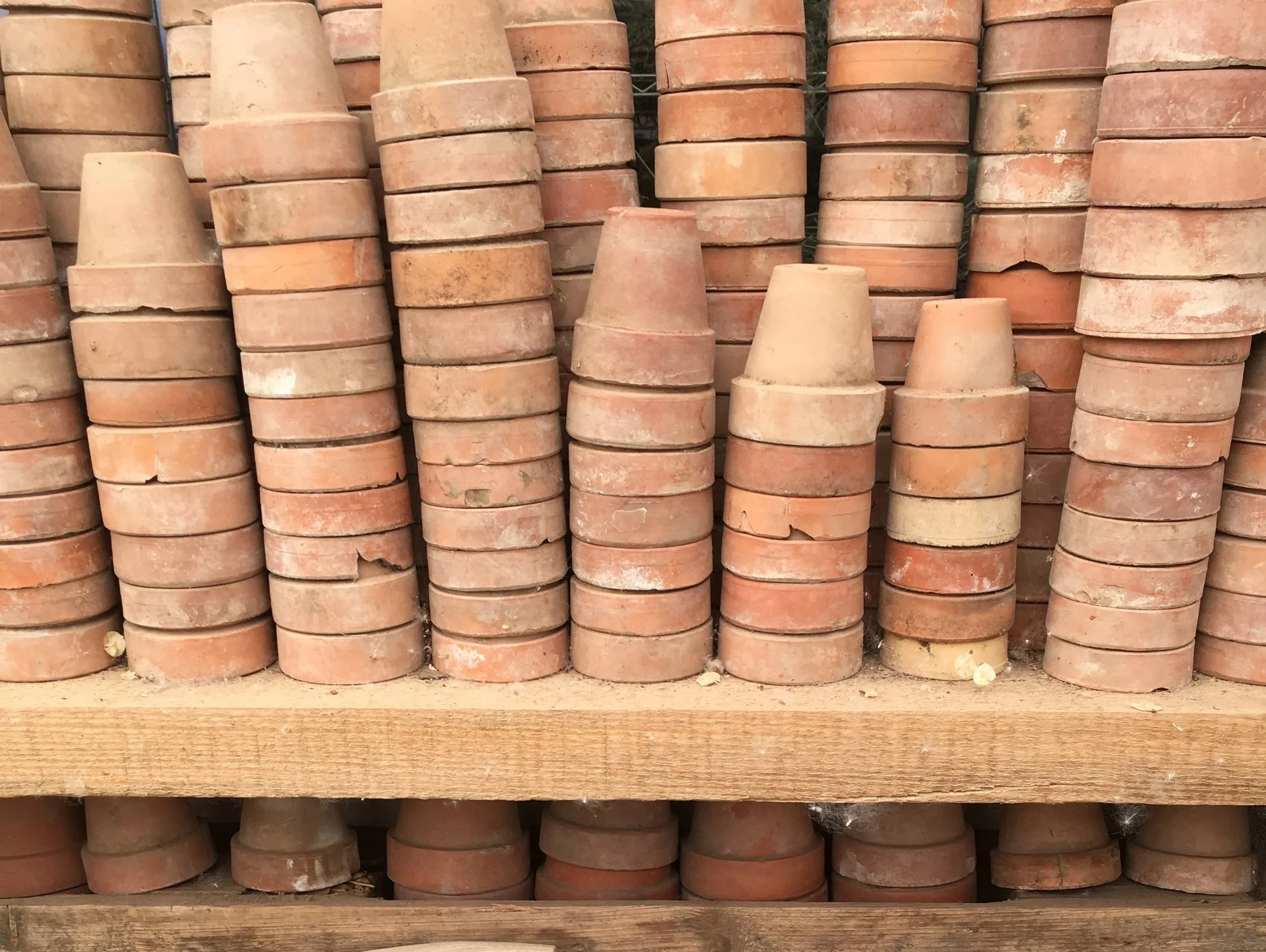 Stacks of small italian terracotta pots