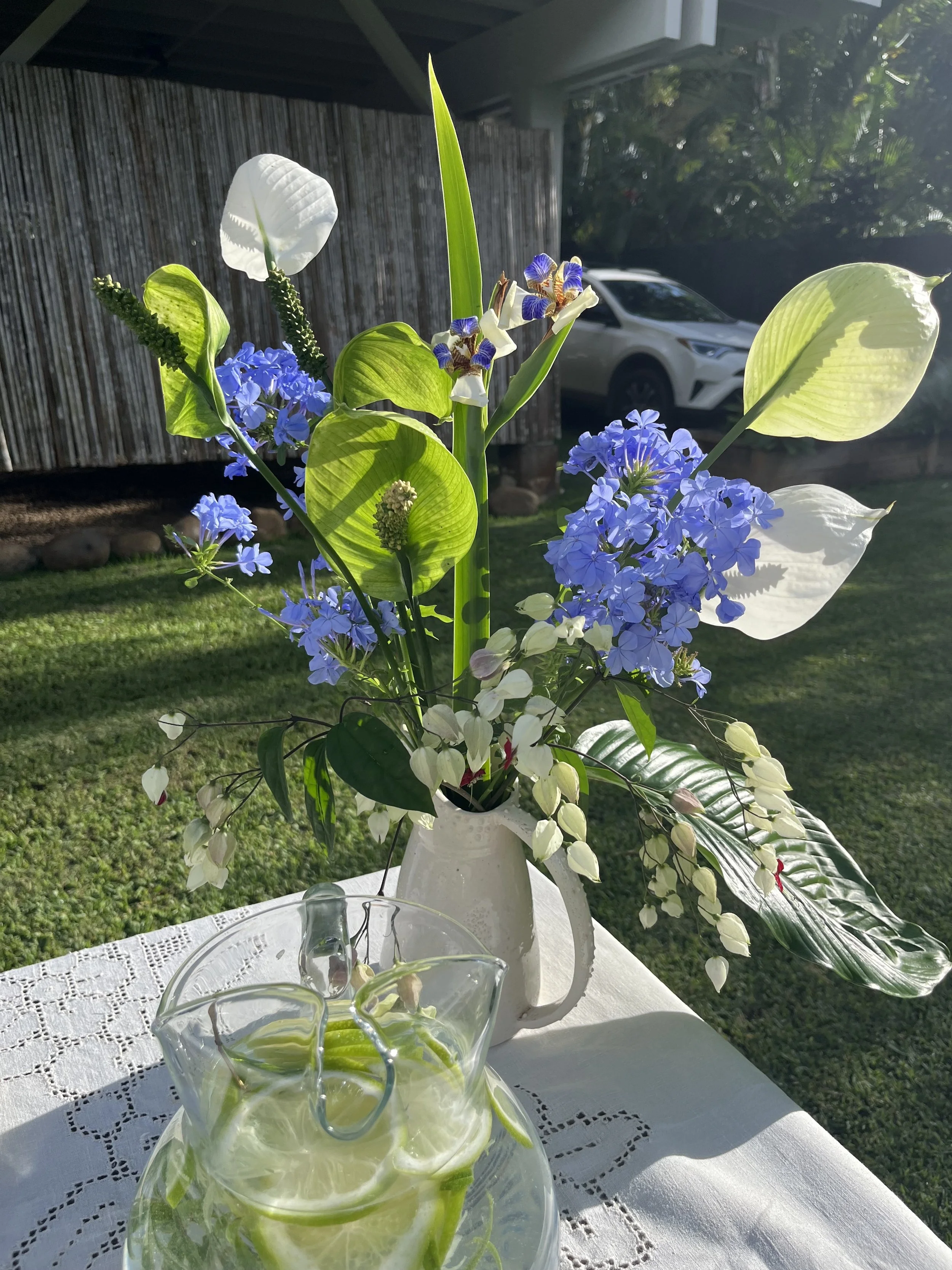 Bouquet of tropical flowers set on a table outside
