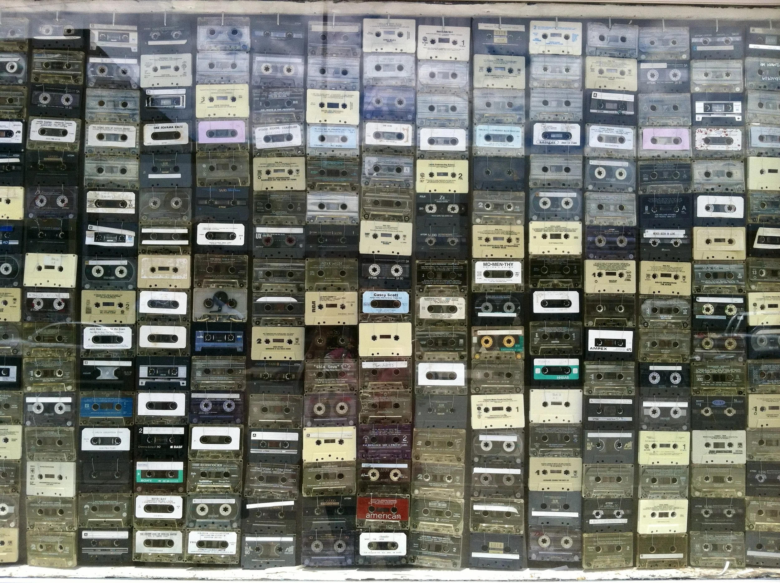 cassette tapes covering the window like wallpaper