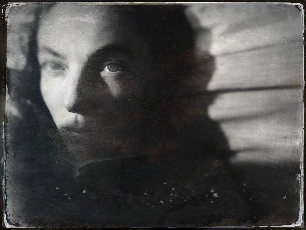 Black and white tin type photo of woman