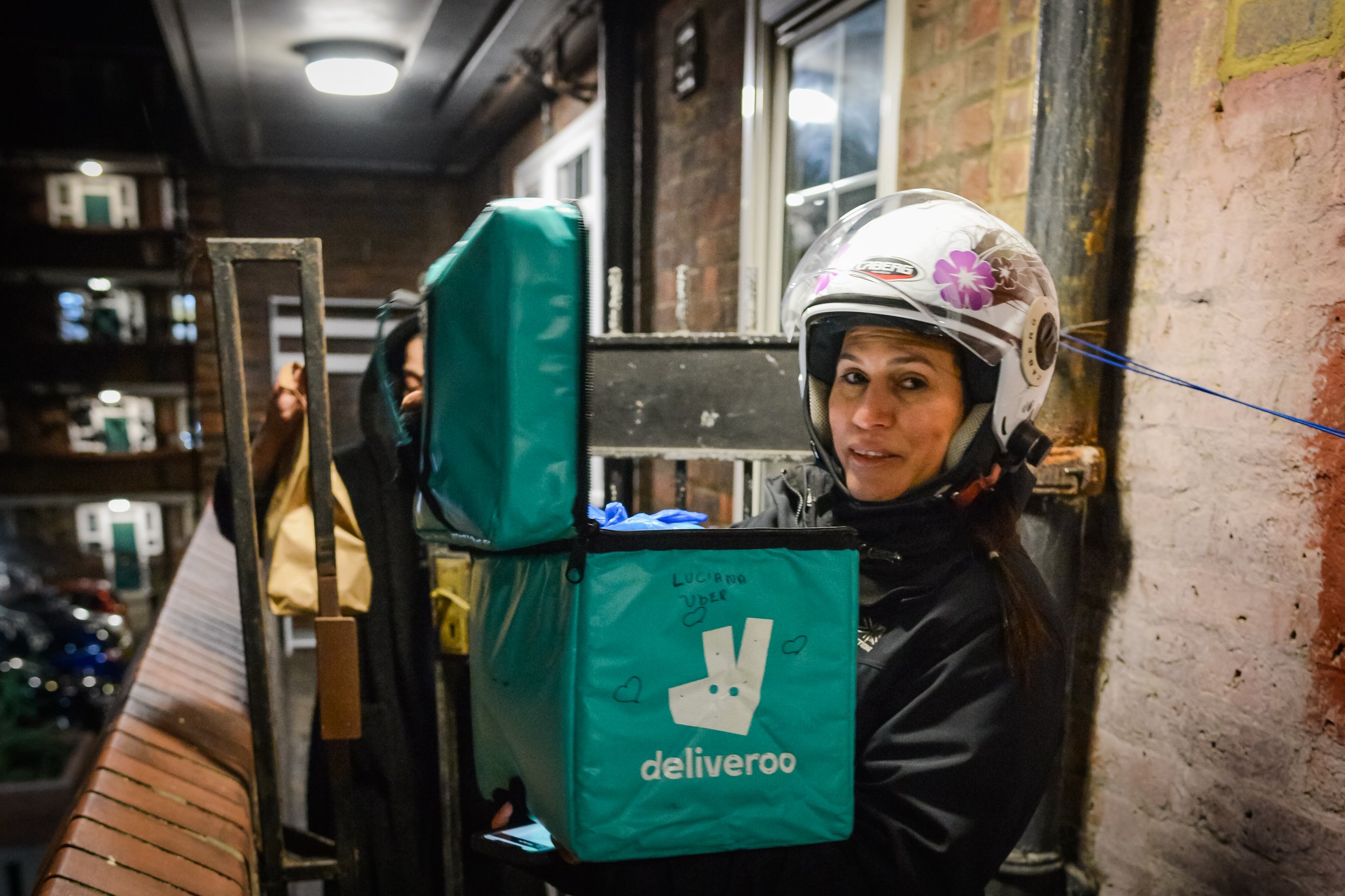  Luciana, riding for 2 years, drops off a delivery to a man in a local flat 