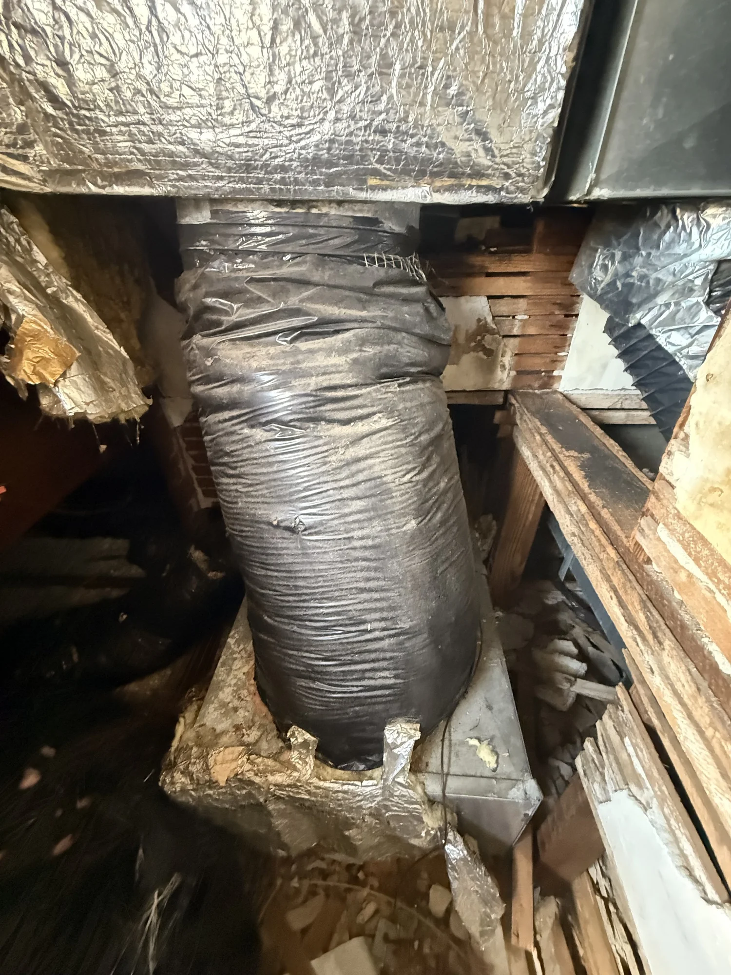 Damaged and disconnected duct connections at rooftop air-handler plenums