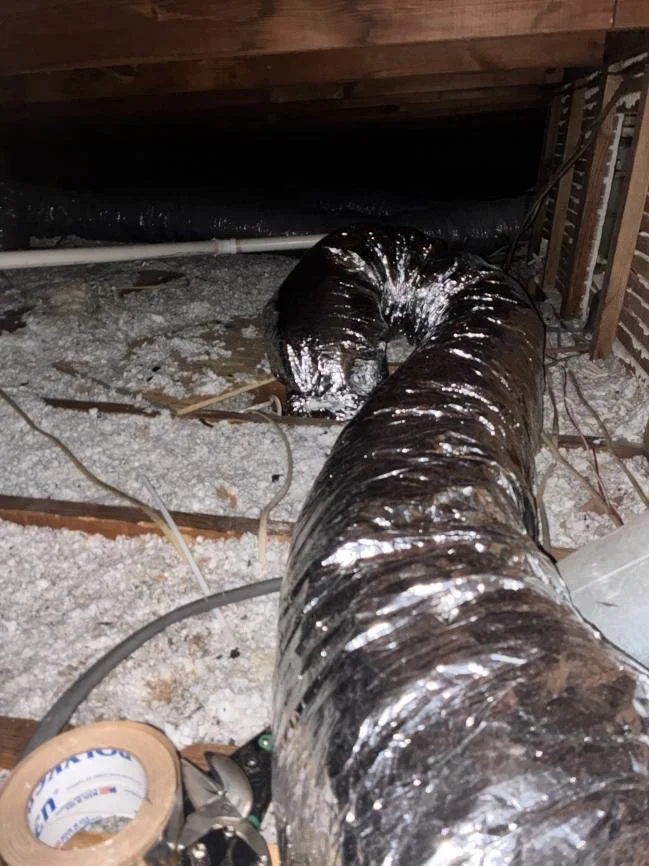 Replacement insulated flexible duct installed in the restricted roof cavity
