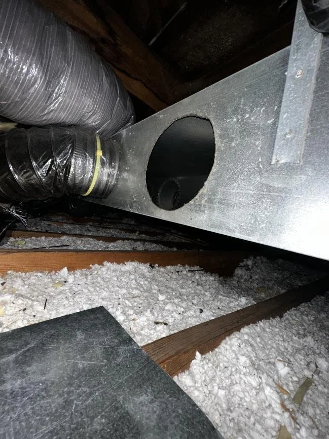 Open circular cutout in galvanized return ductwork before closure