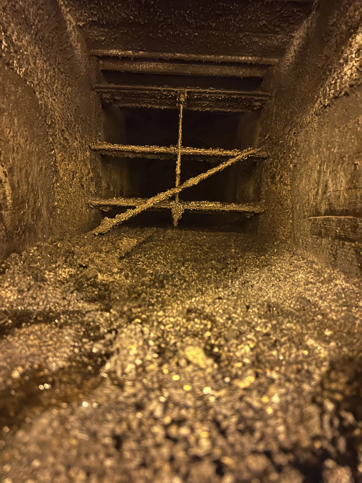 Heavy process-related buildup inside ductwork at a wastewater facility