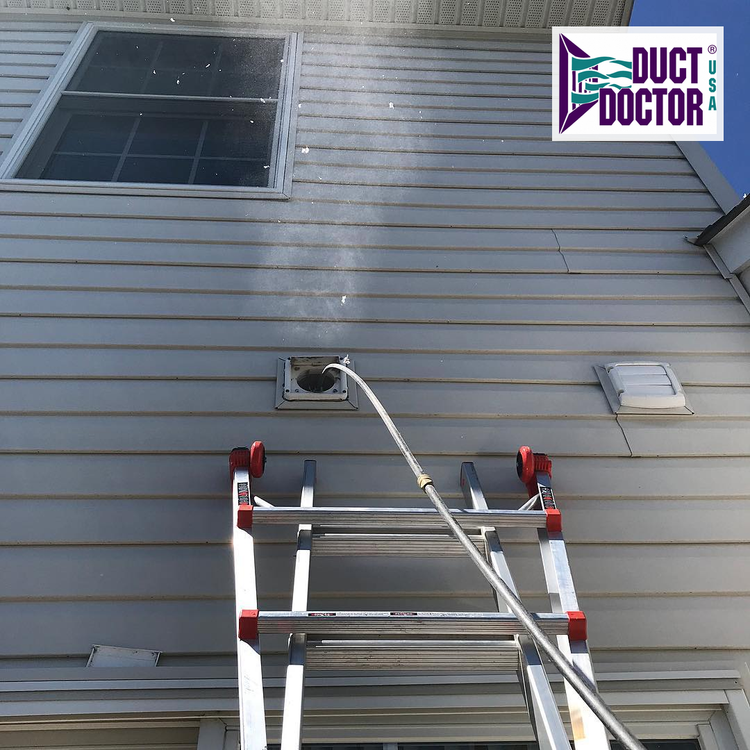 Cleaning line entering an exterior dryer vent above a ladder