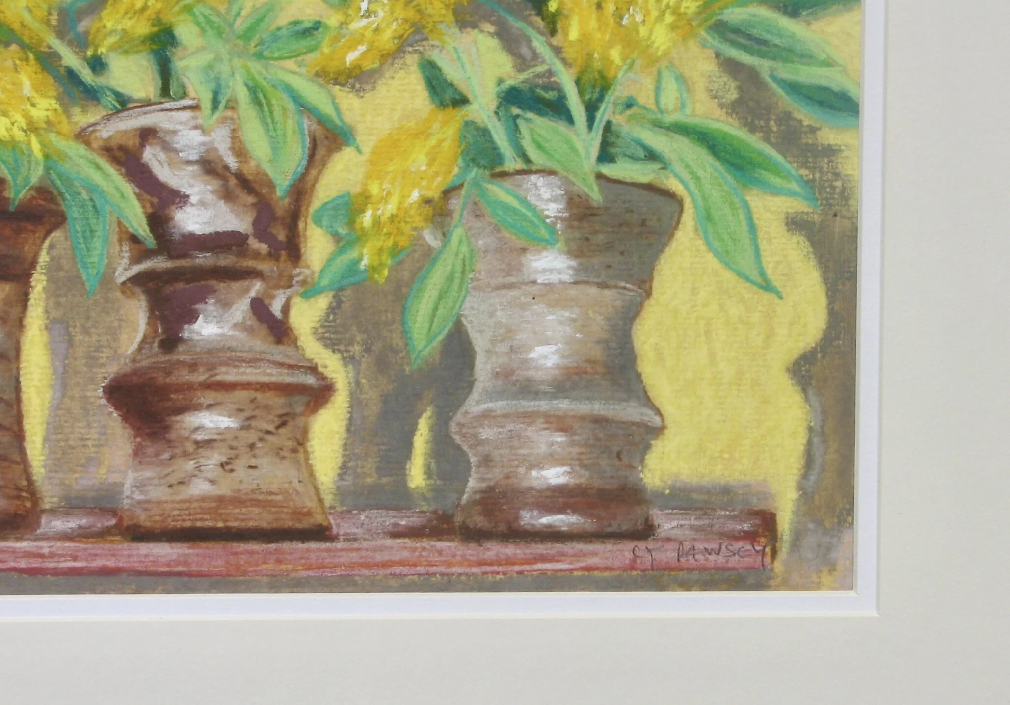 Yellow flowers in three studio pots signed by Cy Pawsey