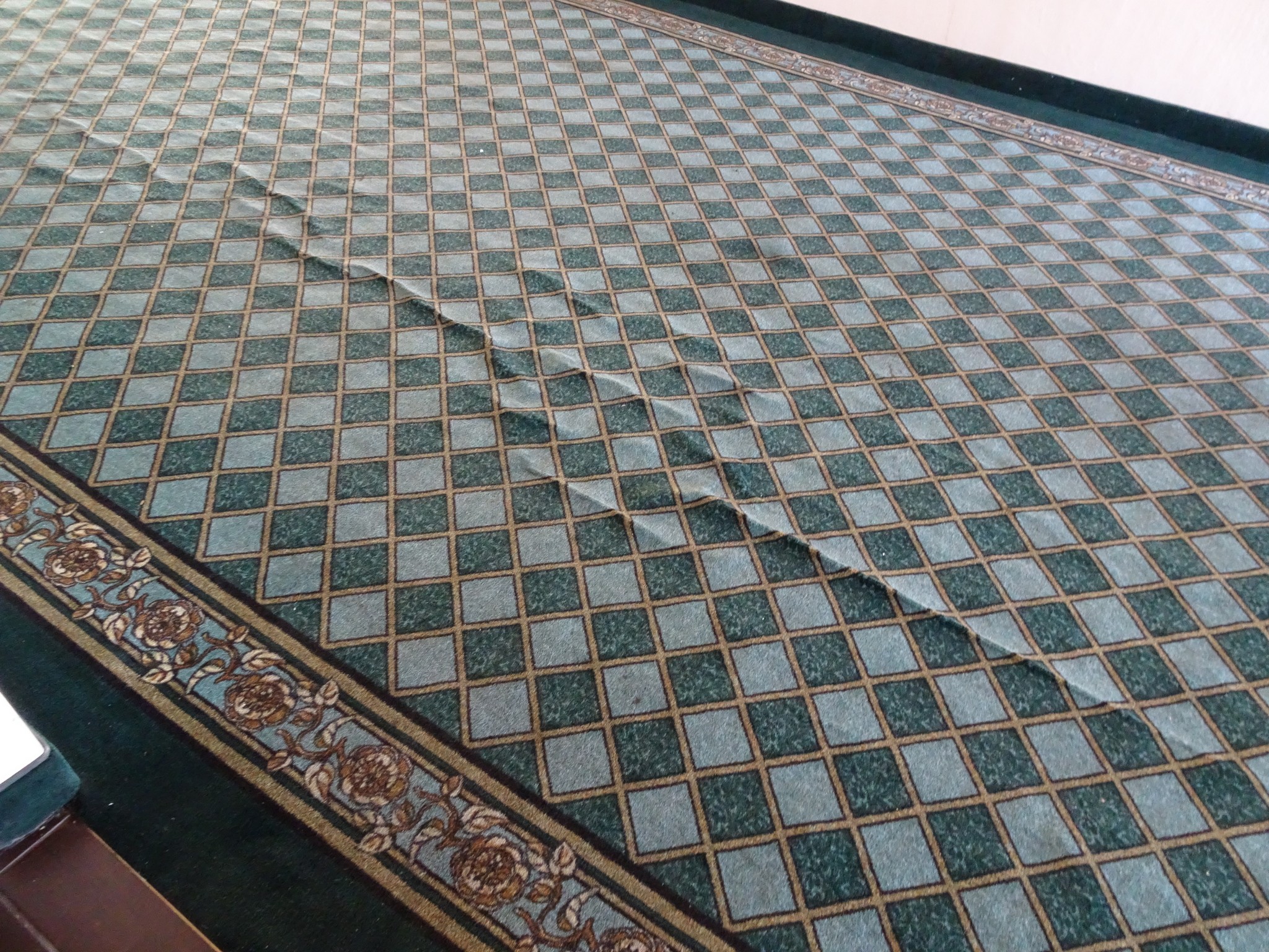 Carpet releasing from gluedown installation