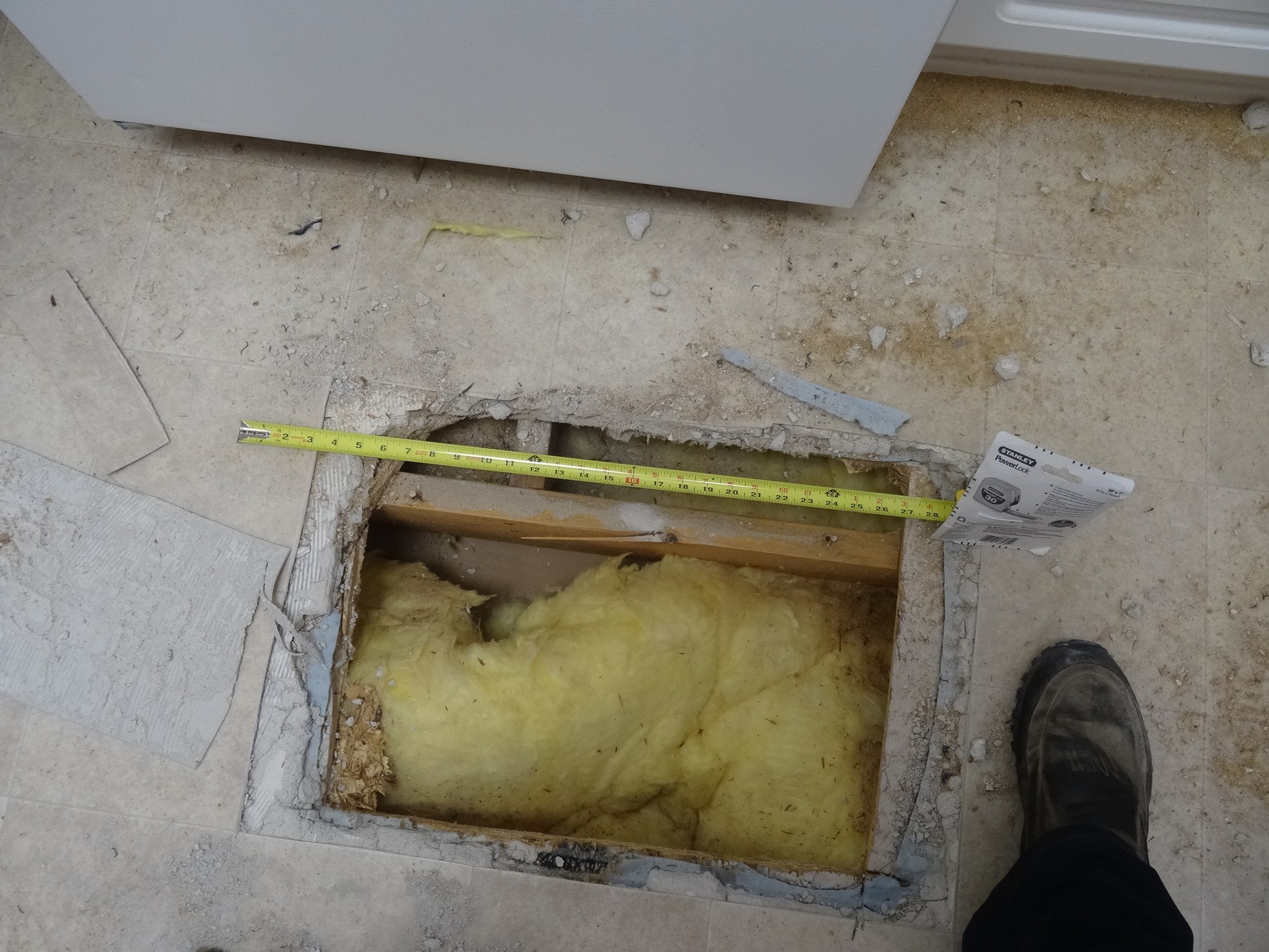 Examination of framing beneath the subfloor