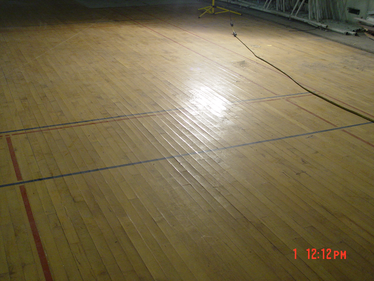 Gymnasium floor cupping after water damage