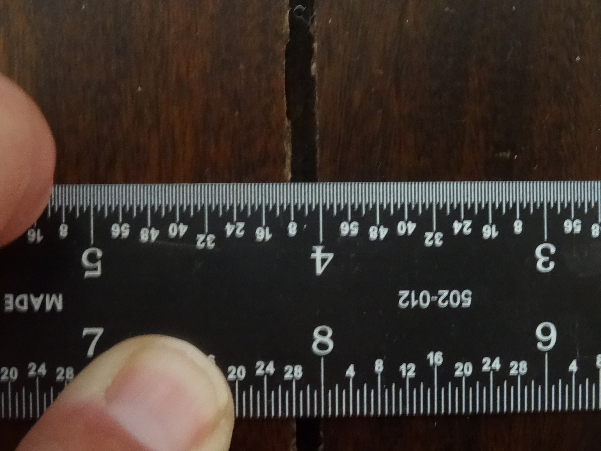 Measuring board width to determine if shrinkage occurred